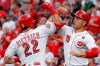 Cincinnati Reds' Derek Dietrich (22) celebrates with Joey Votto (19) after hitting a two-run home run off Houston Astros starting pitcher Justin Verlander during the first inning of a baseball game Tuesday, June 18, 2019, in Cincinnati. (AP Photo/John Minchillo)