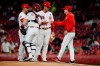Cincinnati Reds starting pitcher Luis Castillo (58) is relieved by Cincinnati Reds manager David Bell, right, in the seventh inning of a baseball game, Thursday, April 25, 2019, in Cincinnati. (AP Photo/John Minchillo)