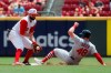 St. Louis Cardinals' Harrison Bader (48) slides into second against Cincinnati Reds second baseman Jose Peraza (9) in the second inning of a baseball game, Sunday, July 21, 2019, in Cincinnati. (AP Photo/John Minchillo)