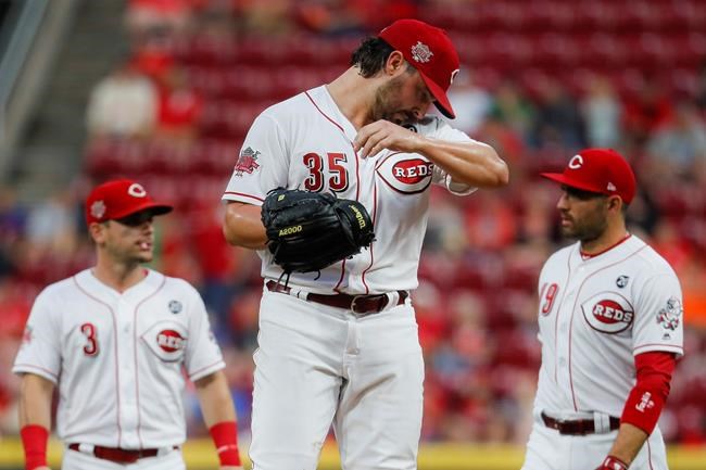 Cincinnati Reds starting pitcher Tanner Roark (35) waits to be relieved in the fourth inning of a baseball game against the Pittsburgh Pirates, Tuesday, July 30, 2019, in Cincinnati. (AP Photo/John Minchillo)