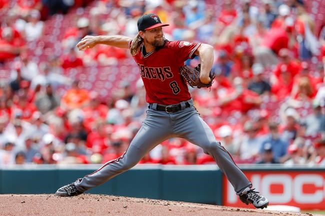 Arizona Diamondbacks starting pitcher Mike Leake throws in the first inning of a baseball game against the Cincinnati Reds, Sunday, Sept. 8, 2019, in Cincinnati. (AP Photo/John Minchillo)