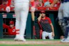 Cincinnati Reds' Joey Votto watches play from in the dugout in the sixth inning of a baseball game against the San Diego Padres, Monday, Aug. 19, 2019, in Cincinnati. (AP Photo/John Minchillo)