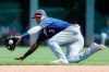 Milwaukee Brewers shortstop Orlando Arcia fields a ground ball hit by Cincinnati Reds' Aristides Aquino before throwing to first for the out in the seventh inning of a baseball game, Thursday, Sept. 26, 2019, in Cincinnati. (AP Photo/John Minchillo)
