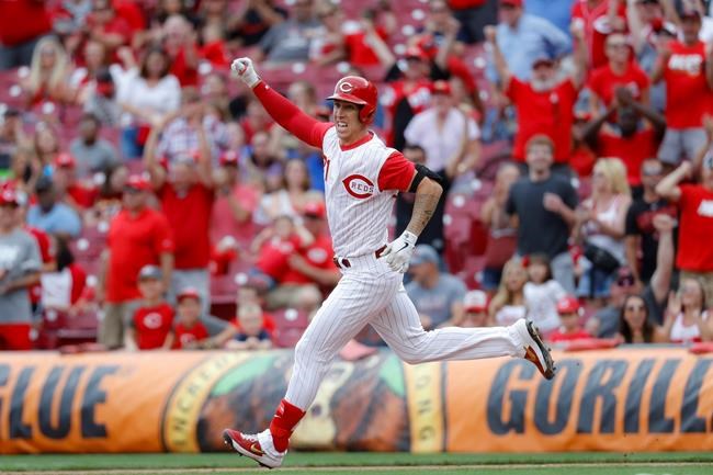 Cincinnati Reds' Michael Lorenzen runs the bases after hitting a game-winning RBI double off Arizona Diamondbacks relief pitcher T.J. McFarland in the ninth inning of a baseball game, Sunday, Sept. 8, 2019, in Cincinnati. (AP Photo/John Minchillo)