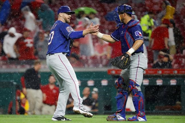 Texas Rangers relief pitcher Shawn Kelley, left, celebrates with catcher Jeff Mathis after the team's baseball game against the Cincinnati Reds, Saturday, June 15, 2019, in Cincinnati. (AP Photo/John Minchillo)