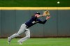 Milwaukee Brewers left fielder Ben Gamel catches a fly ball hit by Cincinnati Reds' Jose Iglesias for an out during the ninth inning of a baseball game Tuesday, Sept. 24, 2019, in Cincinnati. (AP Photo/John Minchillo)