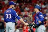 Texas Rangers relief pitcher Drew Smyly (33) celebrates with catcher Tim Federowicz, right, after closing the ninth inning of a baseball game against the Cincinnati Reds, Friday, June 14, 2019, in Cincinnati. (AP Photo/John Minchillo)