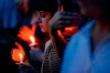 Mourners bow their heads in prayer as they gather for a vigil at the scene of a mass shooting, Sunday, Aug. 4, 2019, in Dayton, Ohio. Multiple people in Ohio were killed in the second mass shooting in the U.S. in less than 24 hours. (AP Photo/John Minchillo)