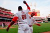 Cincinnati Reds' Tucker Barnhart (16) celebrates with Yasiel Puig (66) after hitting a solo home run off Atlanta Braves starting pitcher Kevin Gausman in the fourth inning of a baseball game, Tuesday, April 23, 2019, in Cincinnati. (AP Photo/John Minchillo)