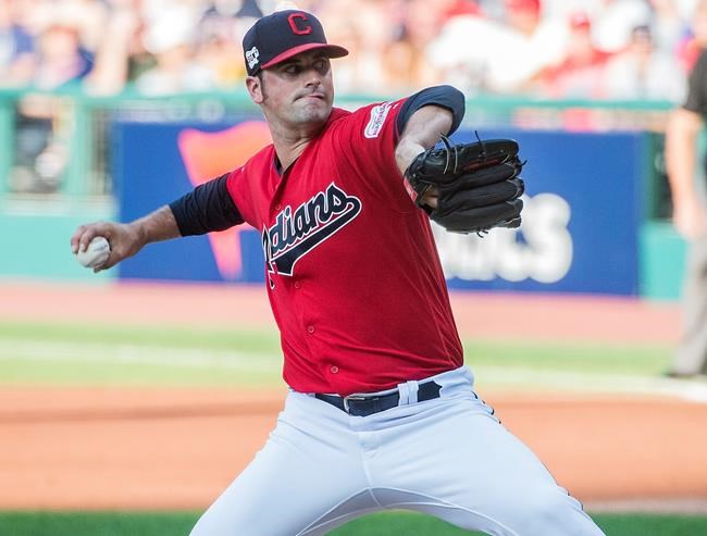 Cleveland Indians starting pitcher Adam Plutko delivers to Los Angeles Angels' Shohei Ohtani during the first inning of a baseball game in Cleveland, Saturday, Aug. 3, 2019. (AP Photo/Phil Long)