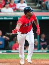 Cleveland Indians' Yasiel Puig watches his double off Houston Astros starting pitcher Gerrit Cole during the fourth inning of a baseball game in Cleveland, Thursday, Aug. 1, 2019. (AP Photo/Phil Long)