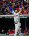 Philadelphia Phillies' Bryce Harper celebrates after hitting a three-run home run off Cleveland Indians relief pitcher Oliver Perez during the fifth inning of a baseball game in Cleveland, Saturday, Sept. 21, 2019. (AP Photo/Phil Long)