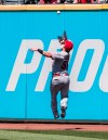 Los Angeles Angels' Kole Calhoun misses a fly ball by Cleveland Indians' Jordan Luplow during the fourth inning of a baseball game in Cleveland, Sunday, Aug. 4, 2019. (AP Photo/Phil Long)