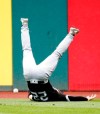 Chicago White Sox's Charlie Tilson slips and falls trying to field a double by Cleveland Indians' Francisco Lindor during the fifth inning of a baseball game, Thursday, May 9, 2019, in Cleveland. (AP Photo/Ron Schwane)