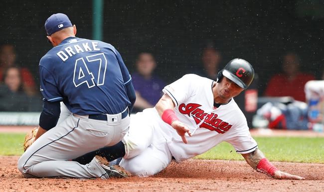 Tampa Bay Rays relief pitcher Oliver Drake (47) tags out Cleveland Indians' Leonys Martin, right, at home plate during the seventh inning of a baseball game, Sunday, May 26, 2019, in Cleveland. (AP Photo/Ron Schwane)