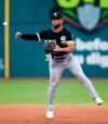 Chicago White Sox's Yoan Moncada throws out Cleveland Indians' Jason Kipnis at first base during the seventh inning of a baseball game Wednesday, May 8, 2019, in Cleveland. (AP Photo/Ron Schwane)
