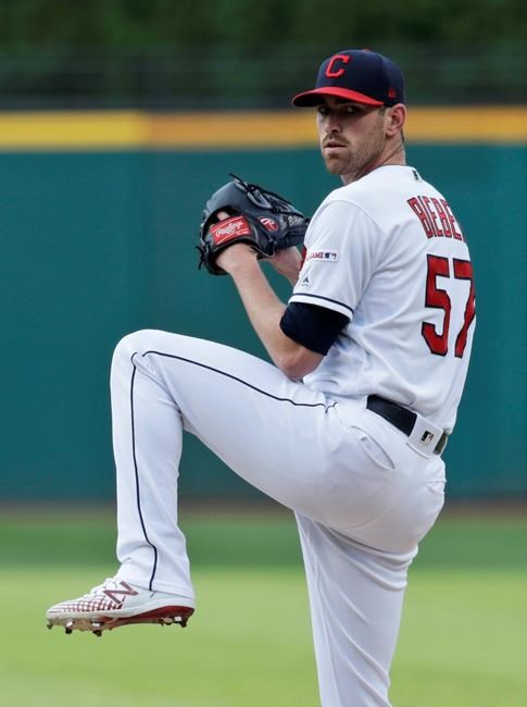 Cleveland Indians starting pitcher Shane Bieber delivers in the first inning of a baseball game against the Houston Astros, Tuesday, July 30, 2019, in Cleveland. (AP Photo/Tony Dejak)
