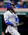 Toronto Blue Jays' Freddy Galvis watch his two-run home run off Cleveland Indians starting pitcher Shane Bieber during the fifth inning of a baseball game Friday, April 5, 2019, in Cleveland. (AP Photo/Tony Dejak)