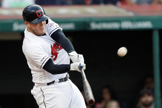 Cleveland Indians' Roberto Perez hits a three-run home run during the second inning of the team's baseball game against the Houston Astros, Wednesday, July 31, 2019, in Cleveland. (AP Photo/Tony Dejak)