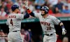 Houston Astros' Robinson Chirinos, right, celebrates with George Springer after Chirinos hit a solo home run in the fifth inning of a baseball game against the Cleveland Indians, Tuesday, July 30, 2019, in Cleveland. (AP Photo/Tony Dejak)