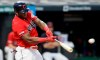 Cleveland Indians' Yasiel Puig hits an RBI-single in the first inning in a baseball game against the Minnesota Twins, Friday, Sept. 13, 2019, in Cleveland. Oscar Mercado scored on the play. (AP Photo/Tony Dejak)