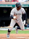 New York Yankees' Didi Gregorius heads to first on a single during the fourth inning of the team's baseball game against the Cleveland Indians, Friday, June 7, 2019, in Cleveland. (AP Photo/Tony Dejak)