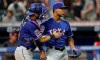 Texas Rangers relief pitcher Jose Leclerc, right, is congratulated by catcher Jeff Mathis after they defeated the Cleveland Indians in a baseball game, Monday, Aug. 5, 2019, in Cleveland. (AP Photo/Tony Dejak)