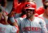 Cincinnati Reds' Curt Casali is congratulated by teammates after hitting a solo home run in the seventh inning in a baseball game against the Cleveland Indians, Wednesday, June 12, 2019, in Cleveland. (AP Photo/Tony Dejak)