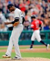 New York Yankees starting pitcher Domingo German, left, waits for Cleveland Indians' Tyler Naquin to run the bases on a solo home run during the fifth inning in a baseball game Friday, June 7, 2019, in Cleveland. (AP Photo/Tony Dejak)