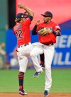 Cleveland Indians' Francisco Lindor, left, and Greg Allen celebrate after the Indians defeated the Kansas City Royals 10-5 in a baseball game Friday, July 19, 2019, in Cleveland. (AP Photo/Tony Dejak)
