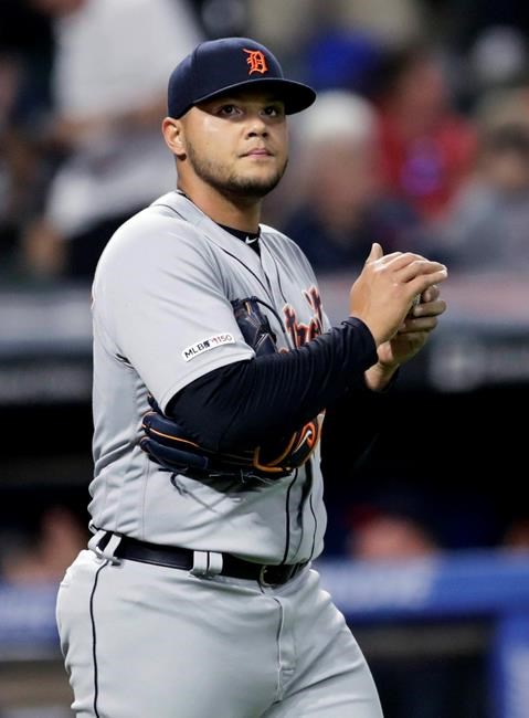 Detroit Tigers relief pitcher Joe Jimenez walks back to the mound after giving up an RBI triple to Cleveland Indians' Jason Kipnis during the eighth inning in a baseball game Friday, June 21, 2019, in Cleveland. The Indians won 7-6. (AP Photo/Tony Dejak)