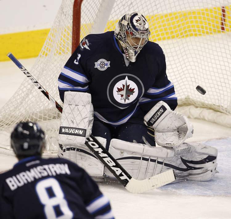 Trevor Hagan / The Canadian Press
Winnipeg Jets' goaltender Ondrej Pavelec (31) eyes the puck as the Jets face the Edmonton Oilers during second-period NHL hockey action in Winnipeg on Monday.