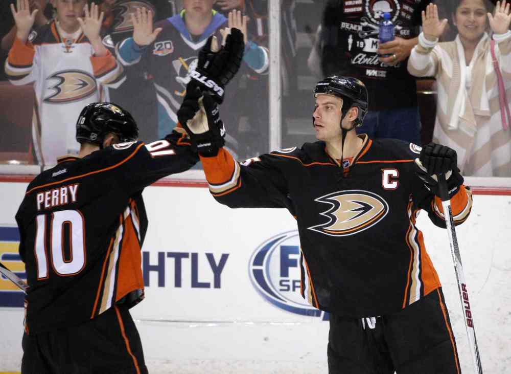 Jae C. Hong / The Associated Press Files
Anaheim Ducks' Corey Perry, left, and Ryan Getzlaf celebrate the team's 5-1 win over the Edmonton Oilers on April 1 in Anaheim, Calif.