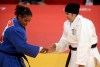 Saudi Arabia's Wojdan Shaherkani and Puerto Rico's Melissa Mojica compete during the women's 78-kg judo competition at the 2012 Summer Olympics, Friday, Aug. 3, 2012, in London. (AP Photo/Mike Groll)