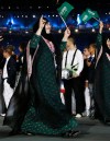 FILE - In this , Friday, July 27, 2012 file photo, Saudi Arabia's Wojdan Ali Seraj Abdulrahim Shahrkhani, parades, along with her team, during the Opening Ceremony at the 2012 Summer Olympics in London. Talks have been underway to allow Shahrkhani, a judo athlete, to compete for Saudi Arabia at the Olympics after the sport's governing federation said she would not be allowed to wear a headscarf. Saudi Arabia, which sent its first two female Olympians to the London Games, had only agreed to let women participate if they adhered to the kingdom's conservative Islamic traditions, including wearing a headscarf. But last Thursday, the International Judo Federation said Shahrkhani, would not be allowed to wear a headscarf because it was against principles of judo and raised safety concerns. (AP Photo/Matt Dunham)