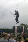 This mobile phone photo provided by Lee Medcalf shows Boris Johnson, the mayor of London, dangling in midair above the crowds at an open-air viewing site at east London’s Victoria Park, on Wednesday, Aug. 1, 2012. (AP Photo/Lee Medcalf)