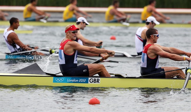 Britain's Alex Partridge and teammates compete to earn bronze in the men's rowing eight in Eton Dorney, near Windsor, England, at the 2012 Summer Olympics, Wednesday, Aug. 1, 2012. (AP Photo/Matt Writtle, Pool)
