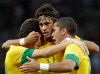 Brazil's Romulo, right, celebrates his goal with his teammates Neymar, center, and Oscar, left, during the men's semifinal soccer match between Brazil and South Korea at the 2012 London Summer Olympics, in Manchester, England, Tuesday, Aug. 7, 2012. (AP Photo/Hussein Malla)