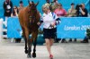 Great Britain's Zara Phillips runs with her horse High Kingdom during horse inspection for the equestrian eventing competition at Greenwich Park, the site for the equestrian and modern pentathlon events at the 2012 Summer Olympics, Friday, July 27, 2012, in London. (AP Photo/Markus Schreiber)