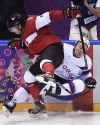 Nathan Denette / THE CANADIAN PRESS
Canada defenceman Drew Doughty levels Norwegian forward Per-Age Skroder in the second period Thursday. Head coach Mike Babcock welcomed the win, but more so the chance to see the players in action.