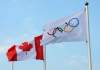 Sean Kilpatrick / The Canadian press
A Canadian flag and Olympic flag blow in the wind in the Athlete Village the 2012 Summer Olympics in London.