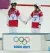 Adrian Wyld / The Canadian Press files
Canada's Justine Dufour-Lapointe and Chloe Dufour-Lapointe hold hands claiming their gold and silver Saturday February 8, 2014 in Sochi, Russia.