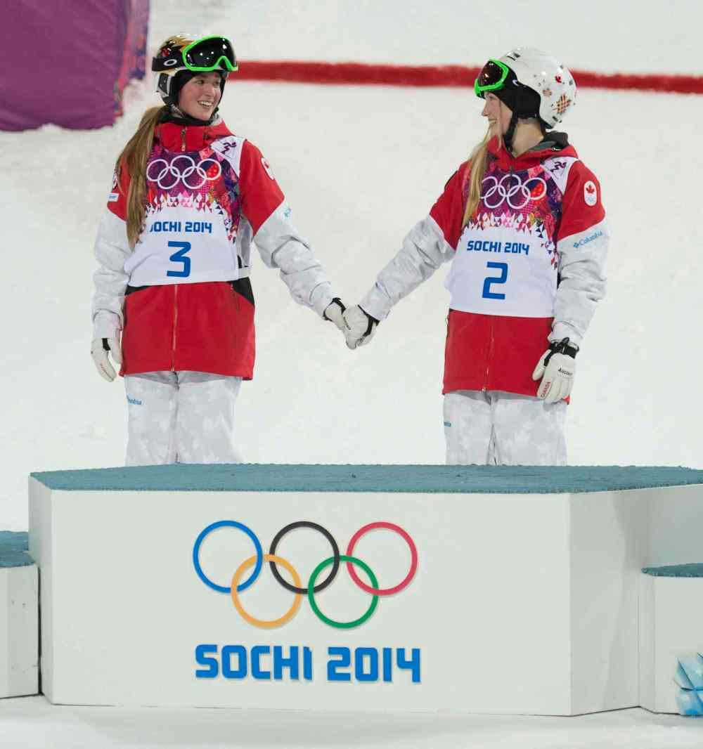 Adrian Wyld / The Canadian Press files
Canada's Justine Dufour-Lapointe and Chloe Dufour-Lapointe hold hands claiming their gold and silver Saturday February 8, 2014 in Sochi, Russia.