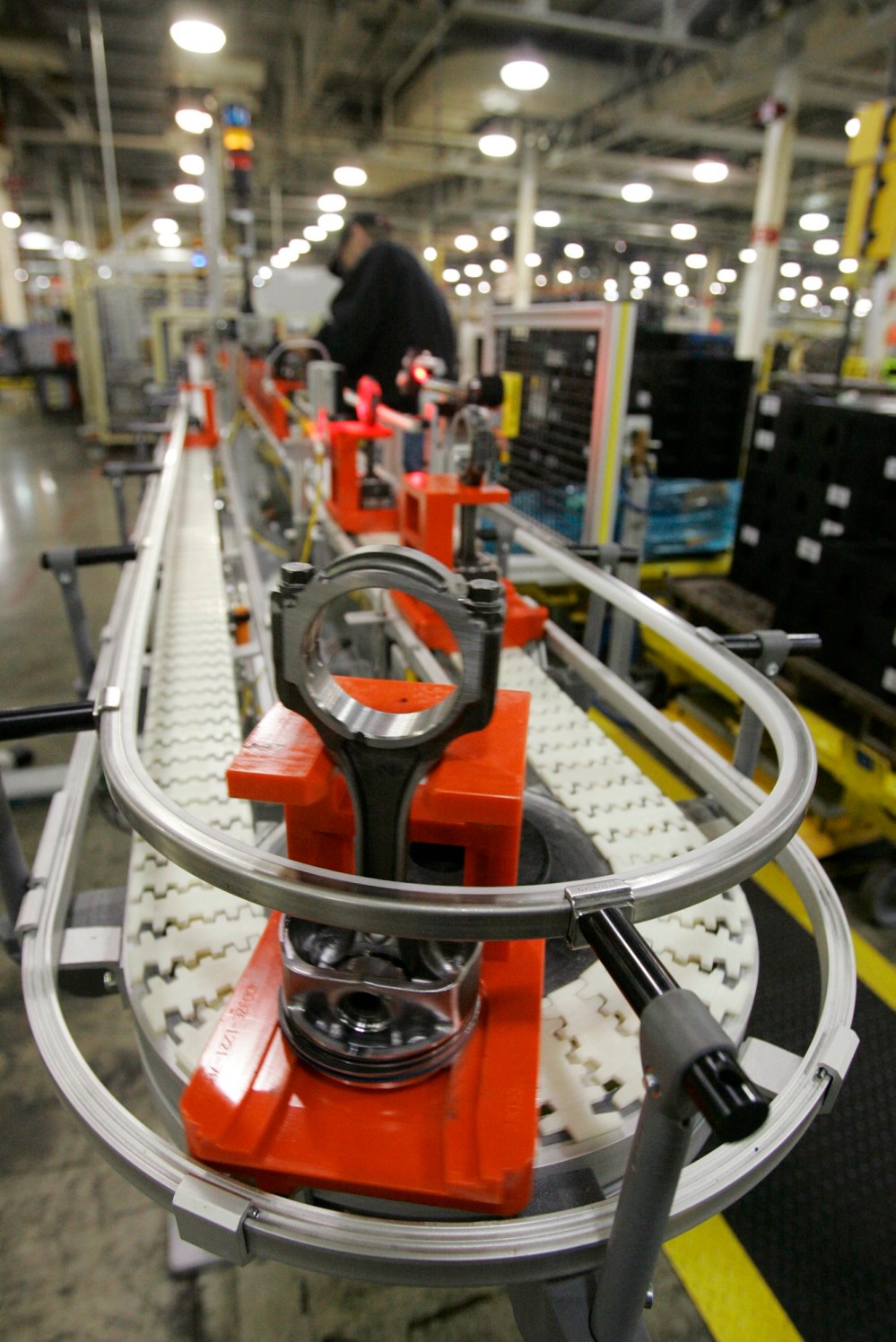AP PHOTO
Assembled pistons for the EcoBoost V-6 engine move along a belt at Ford's Cleveland Engine Plant No. 1 in Brook Park, Ohio.