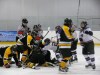 Chris Gareau photo
A linesman is kicked and punched by players while prone on the ice in Stonewall.
