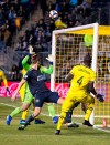 Columbus Crew's Jonathan Mensah, right, kicks the ball over the goal during the first half of an MLS soccer match against the Philadelphia Union, Saturday, March 23, 2019, in Chester, Pa. (AP Photo/Chris Szagola)