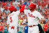 Philadelphia Phillies' Bryce Harper, left, celebrates his two-run home run with Rhys Hoskins during the first inning of the team's baseball game against the Chicago Cubs, Wednesday, Aug. 14, 2019, in Philadelphia. (AP Photo/Chris Szagola)