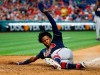 Atlanta Braves' Ronald Acuna Jr. slides to score a run on the hit by Ozzie Albies during the fifth inning of a baseball game against the Philadelphia Phillies, Friday, July 26, 2019, in Philadelphia. (AP Photo/Chris Szagola)
