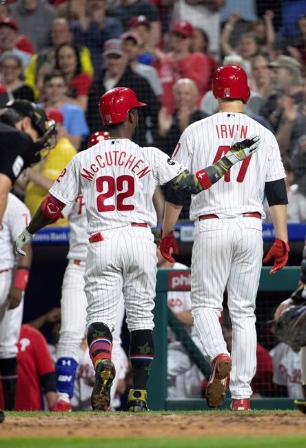 Philadelphia Phillies' Andrew McCutchen, left, celebrates his two-run home run with Cole Irvin during the third inning of the team's baseball game against the Colorado Rockies, Friday, May 17, 2019, in Philadelphia. (AP Photo/Chris Szagola)