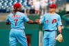 Philadelphia Phillies' J.T. Realmuto, right, celebrates the win with Maikel Franco, left, following the ninth inning of a baseball game against the San Francisco Giants, Thursday, Aug. 1, 2019, in Philadelphia. Phillies won 10-2. (AP Photo/Chris Szagola)
